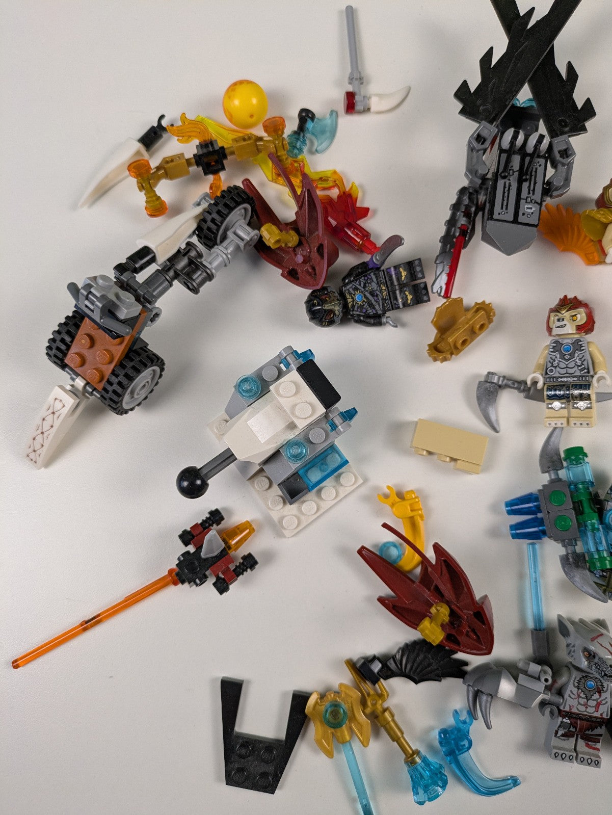 Lego LEGENDS OF CHIMA: 8 Assorted Minifigures w/ Weapons and Assorted Parts
