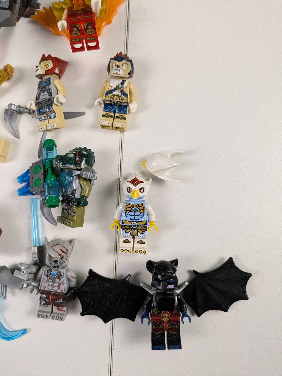 Lego LEGENDS OF CHIMA: 8 Assorted Minifigures w/ Weapons and Assorted Parts