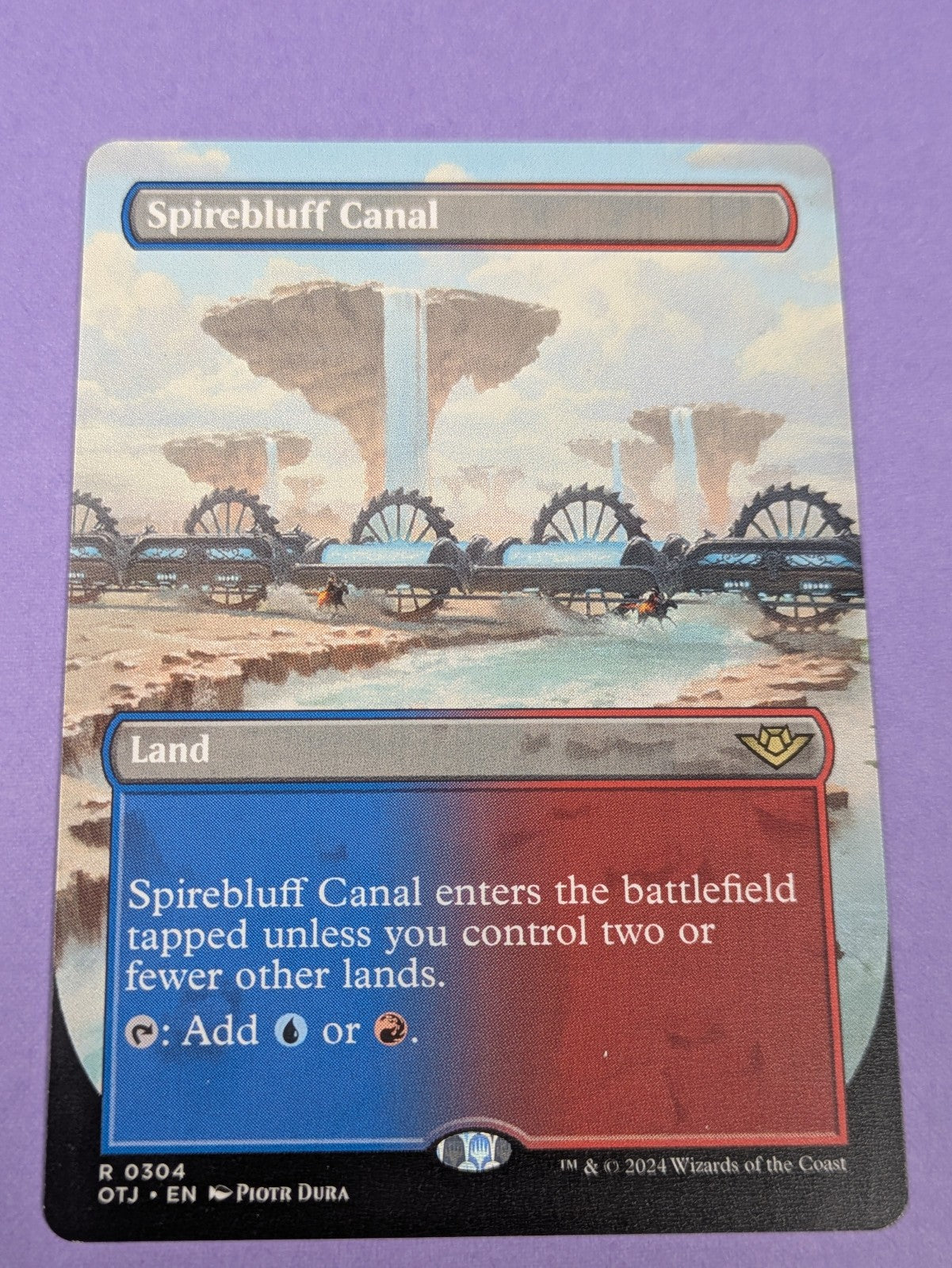 MTG: Outlaws of Thunder Junction: Spirebluff Canal Borderless #0304 Rare - NM