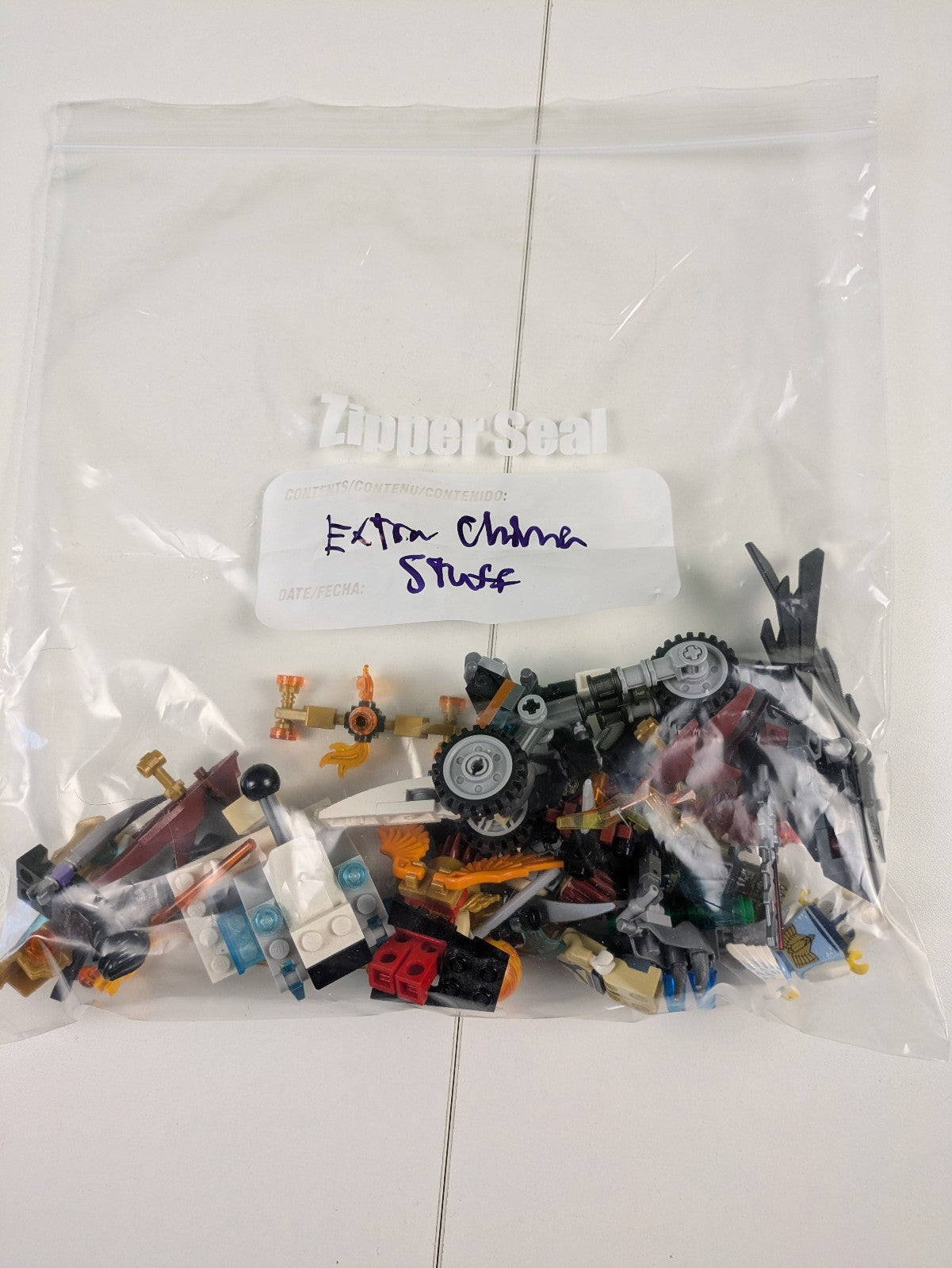 Lego LEGENDS OF CHIMA: 8 Assorted Minifigures w/ Weapons and Assorted Parts
